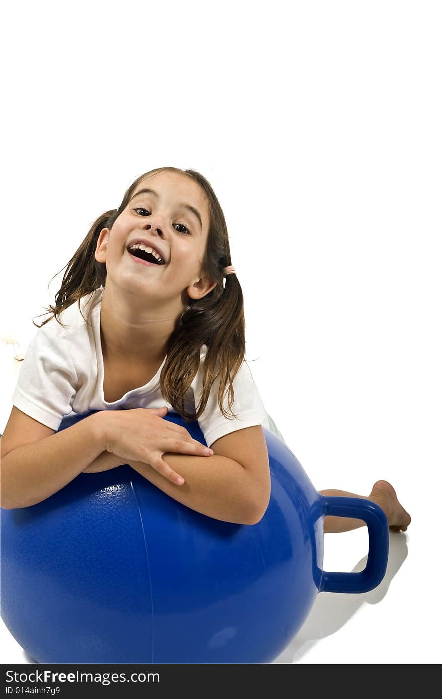 Young girl on a  blue space hopper isolated on white. Young girl on a  blue space hopper isolated on white