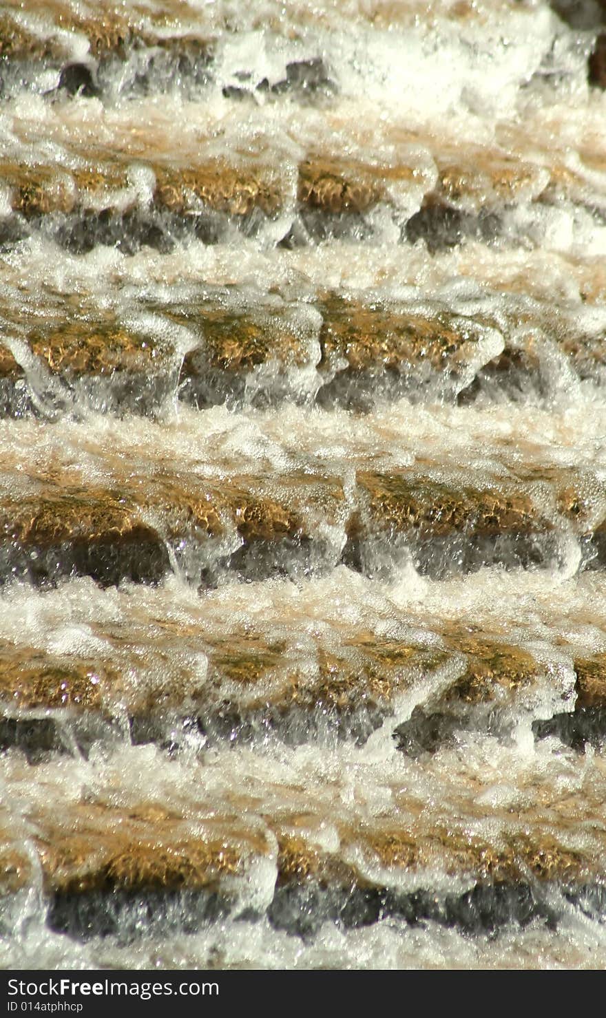 Water rushing down a flight of granite steps, creating abstract horizontal lines, splashes, and blurs . Water rushing down a flight of granite steps, creating abstract horizontal lines, splashes, and blurs