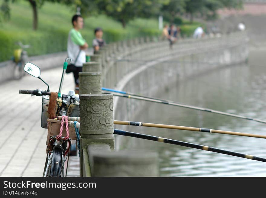 Someone is fishing beside the lake