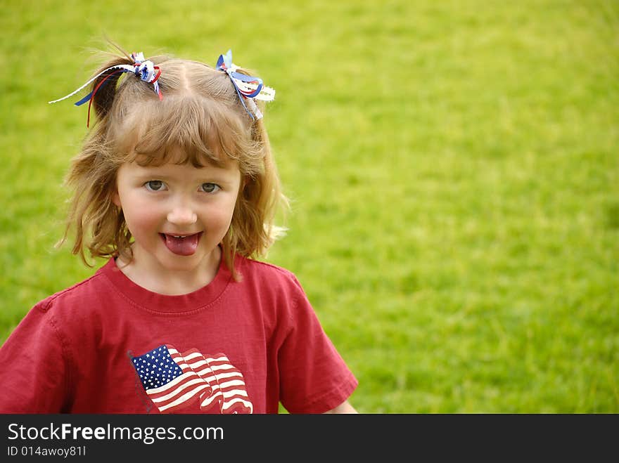 Little girl dressed in red making faces. Little girl dressed in red making faces