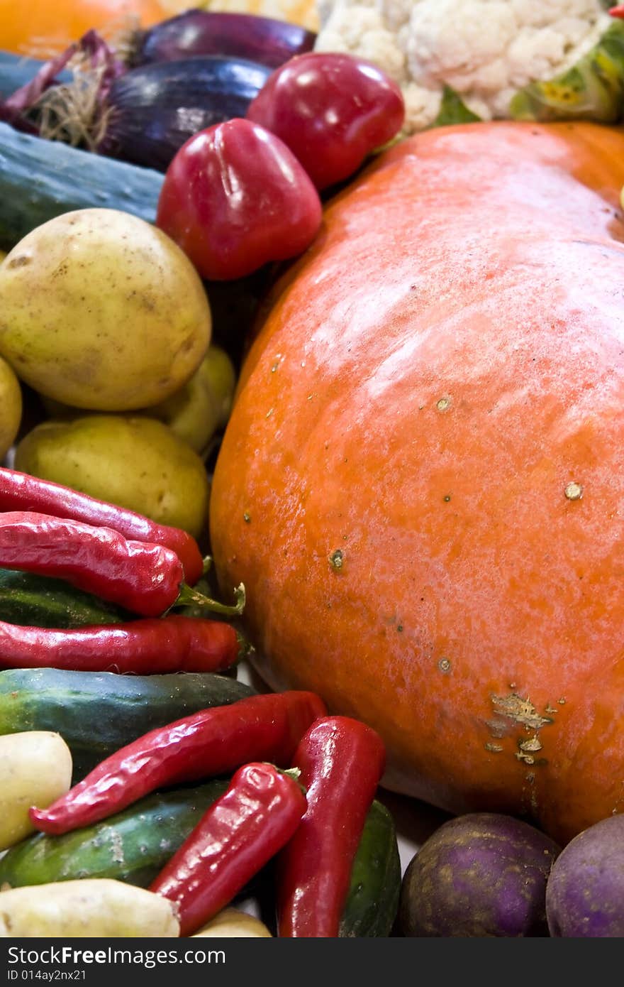 Wheelbarrow full of fall vegetables bright colors. Wheelbarrow full of fall vegetables bright colors