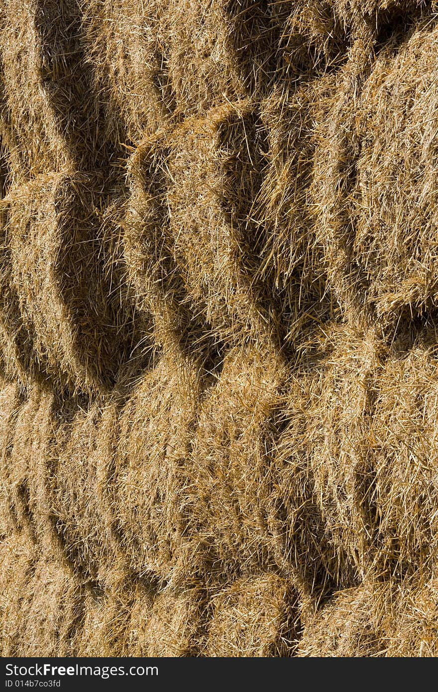 Straw bales stocked on storage place.