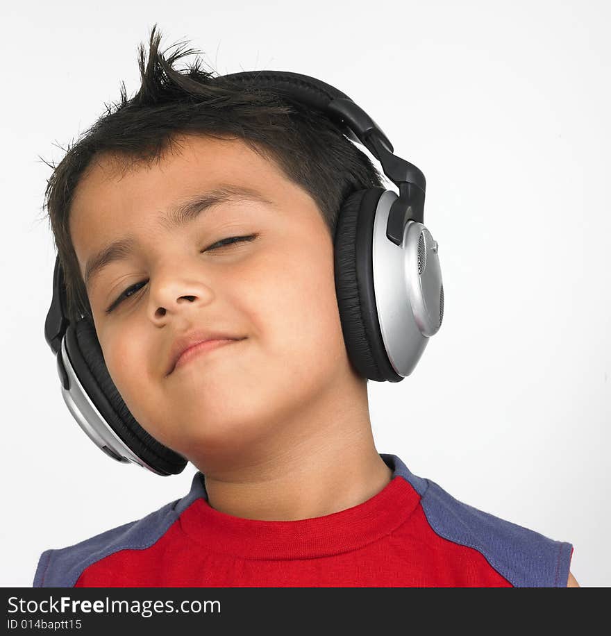 Asian boy with headphones smiling