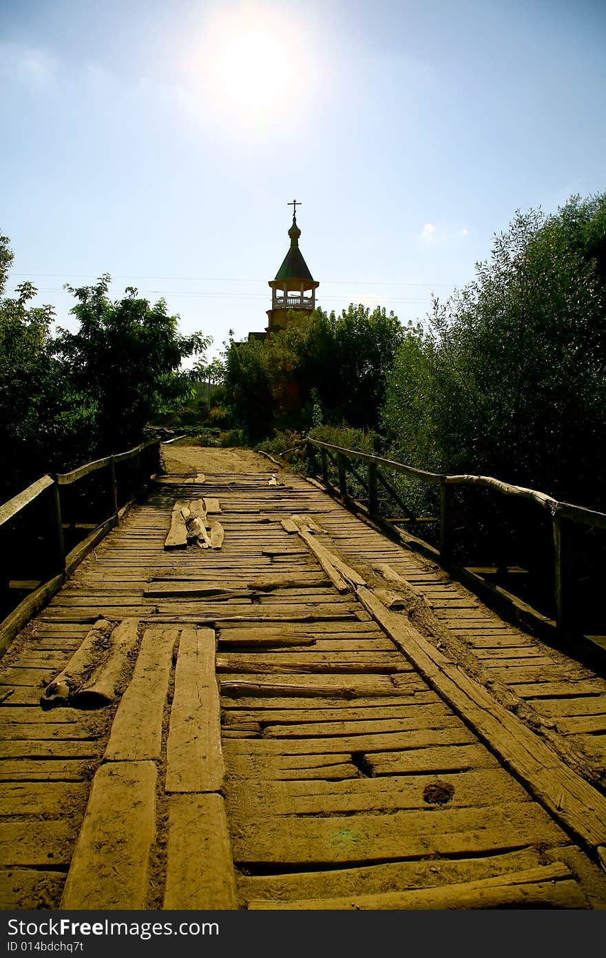 Old wooden foot bridge, blue sky. Old wooden foot bridge, blue sky