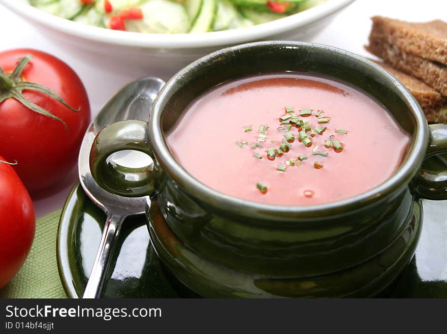 A meal of fresh tomato-sauce with bread and salad. A meal of fresh tomato-sauce with bread and salad