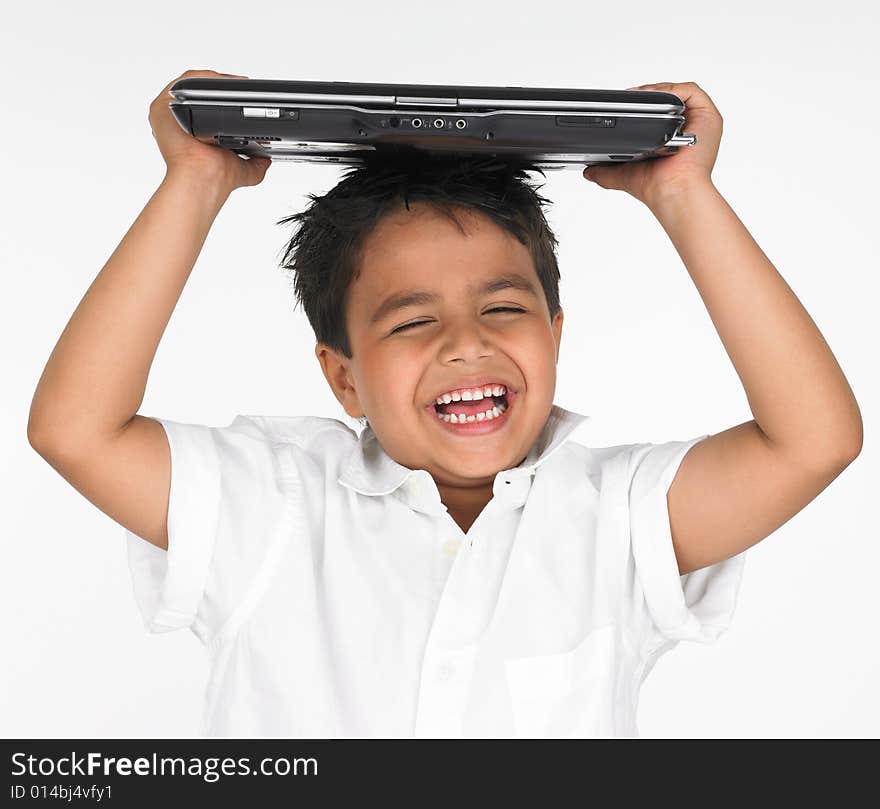 Boy holding laptop on his head