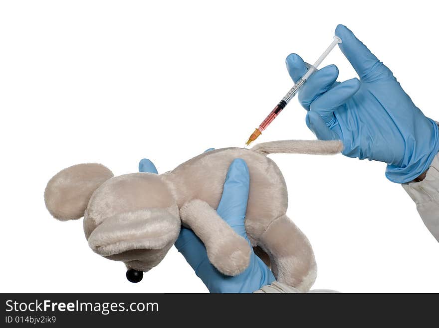 A teddy bunny is getting an injection isolated on white