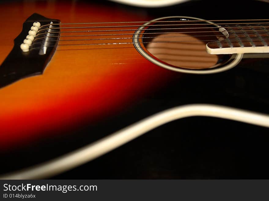 An abstract close up of an acoustic guitar. An abstract close up of an acoustic guitar