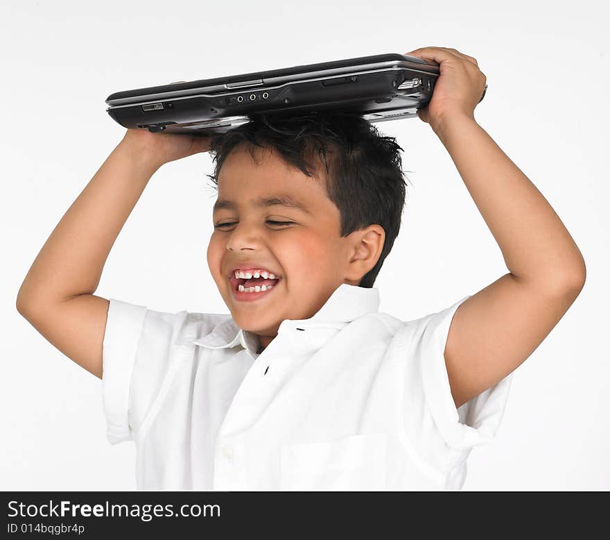 Asian boy holding laptop on his head