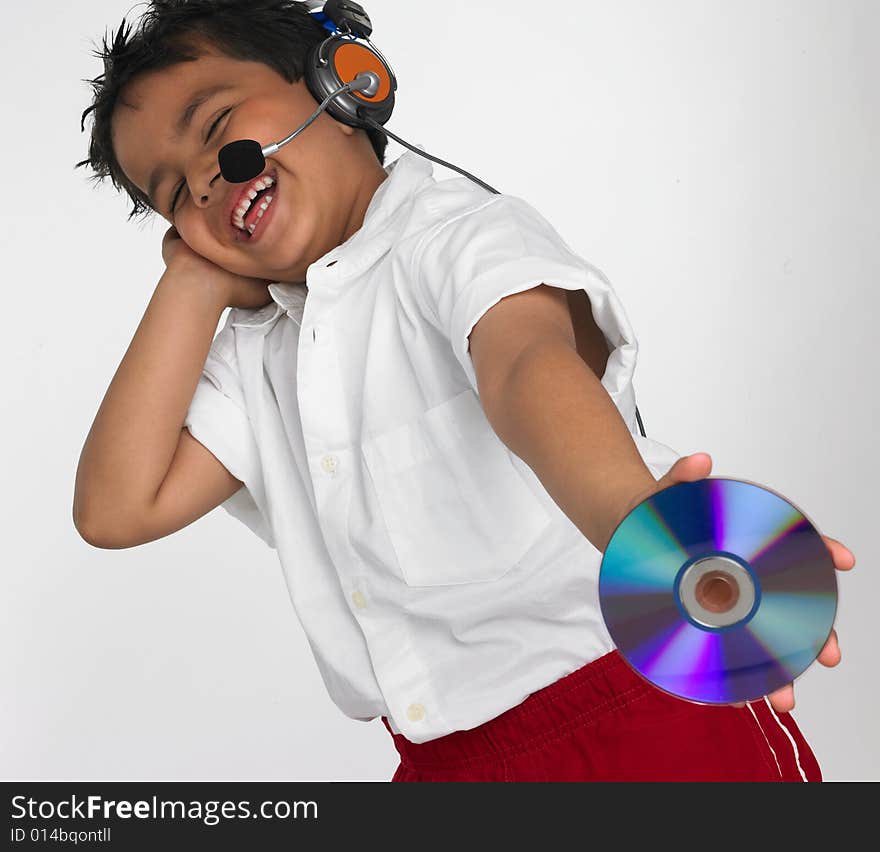 Boy holding cd with headphone