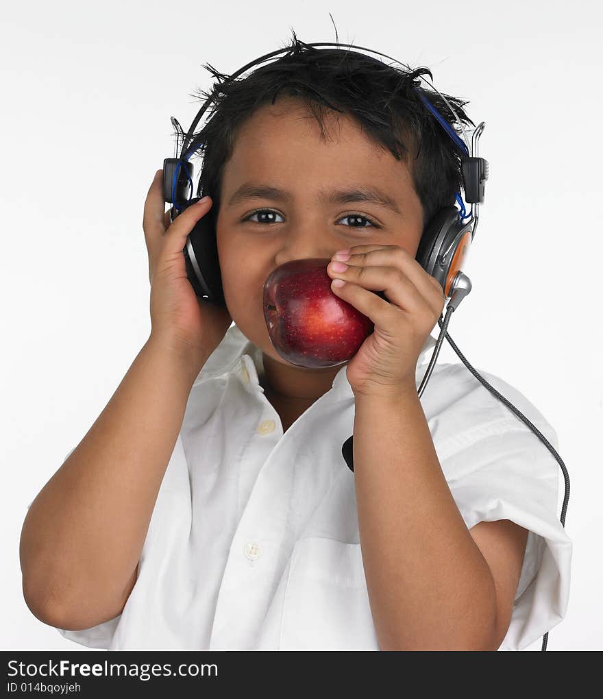 Boy biting an red apple