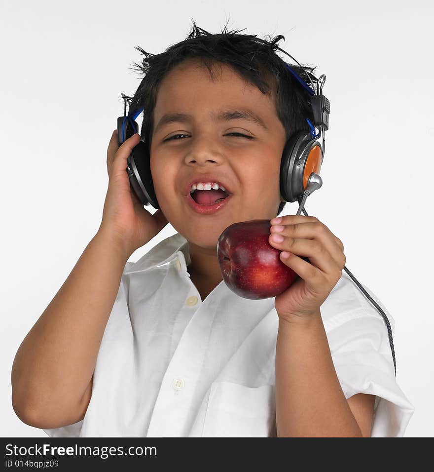 Boy biting an red apple