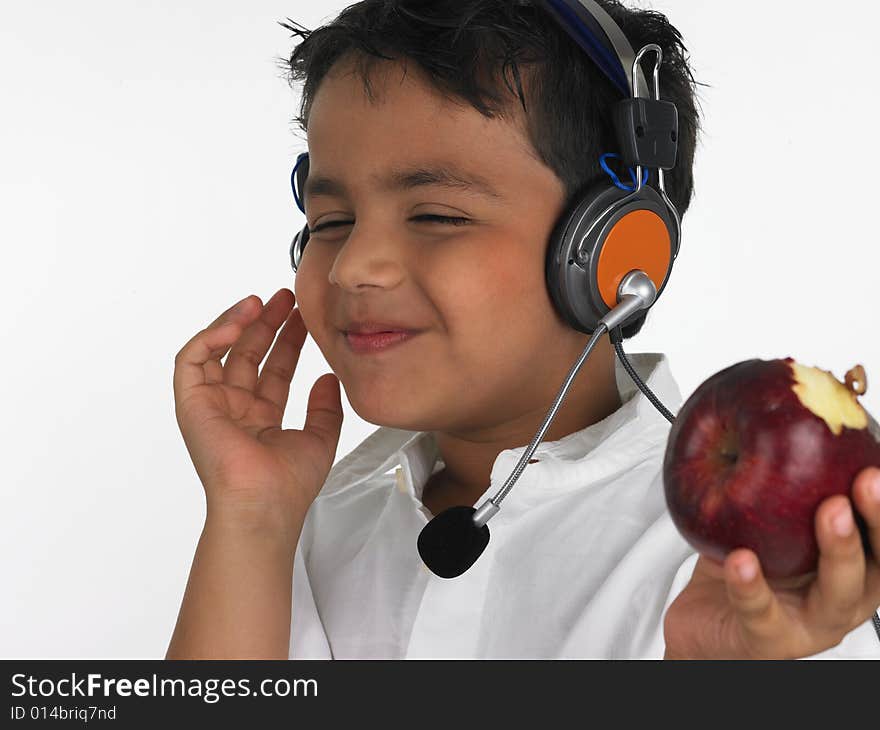 Asian boy biting an red apple