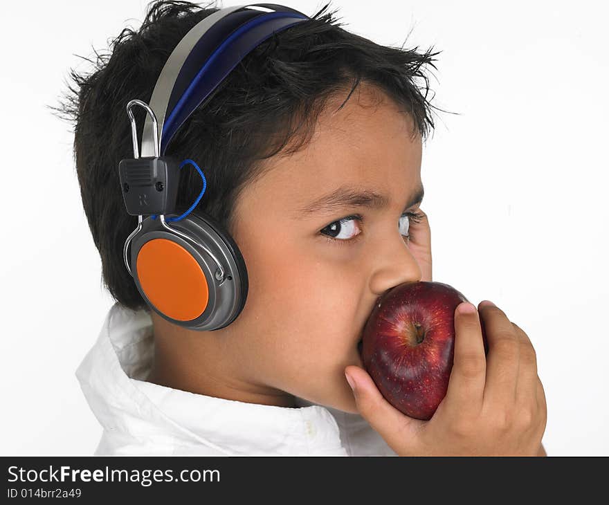 Asian boy biting a apple