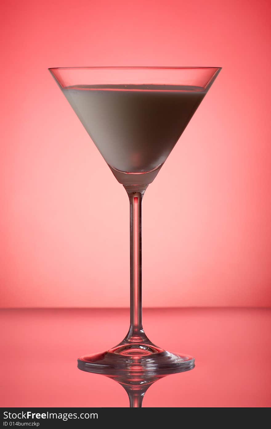 Milky cocktail on red background