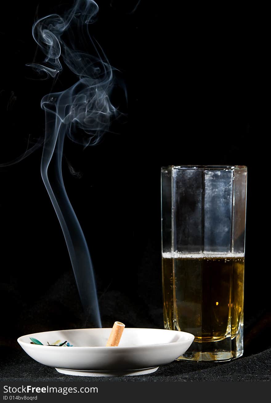 Cigarette smoke and beer drink. Cigarette smoke and beer drink