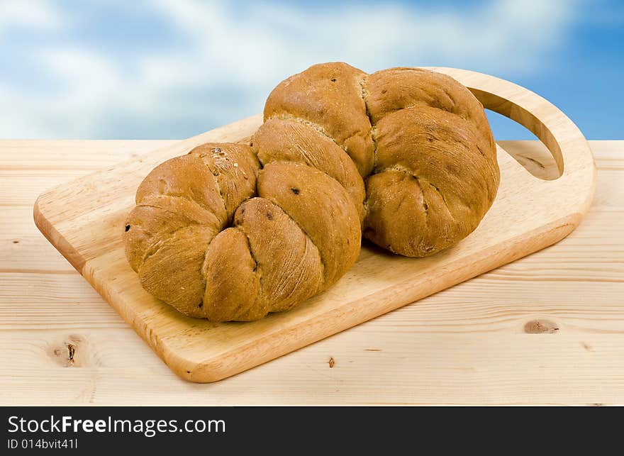 Root shaped bread on a cutting board. Root shaped bread on a cutting board