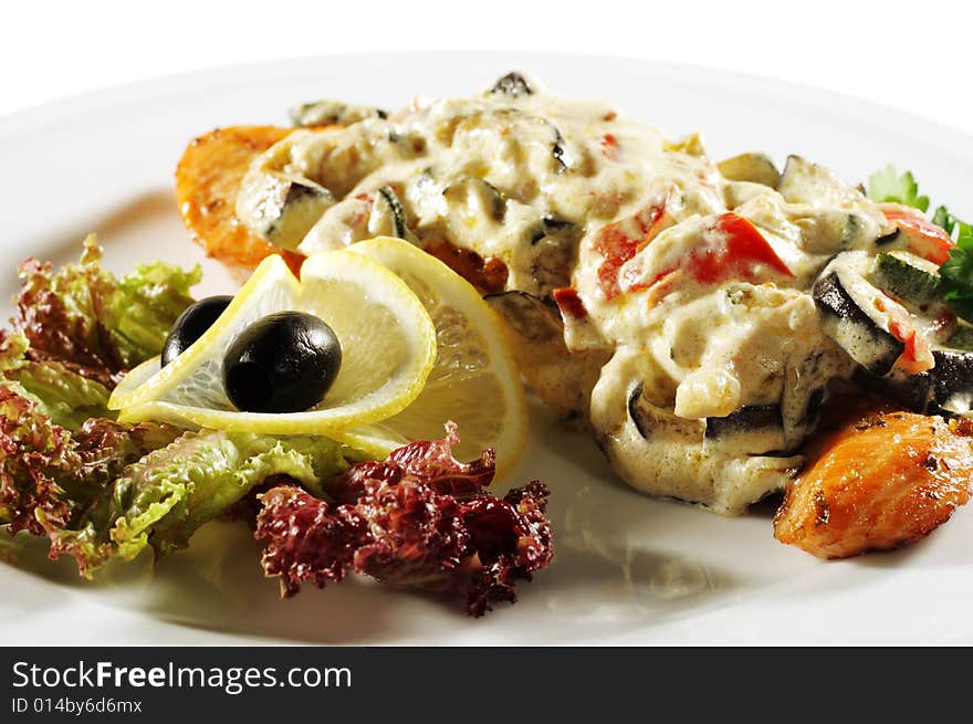 Salmon Steak Plate under Vegetable with Cream. Isolated on White Background. Salmon Steak Plate under Vegetable with Cream. Isolated on White Background