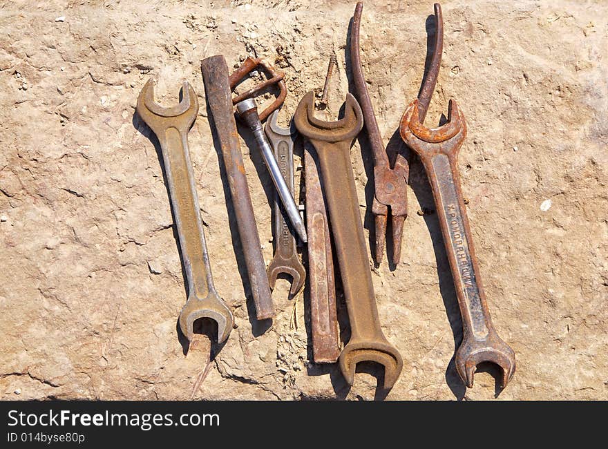 Assorted tools on concrete block. Assorted tools on concrete block.