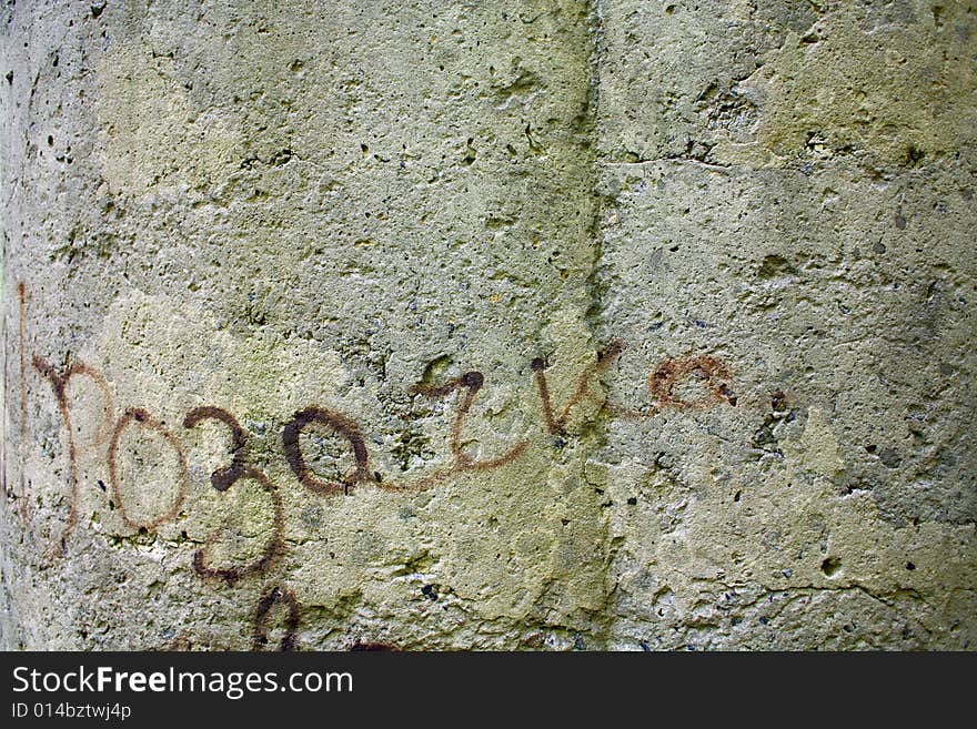 Concrete wall with cracked gray paint worn by weather. Concrete wall with cracked gray paint worn by weather.