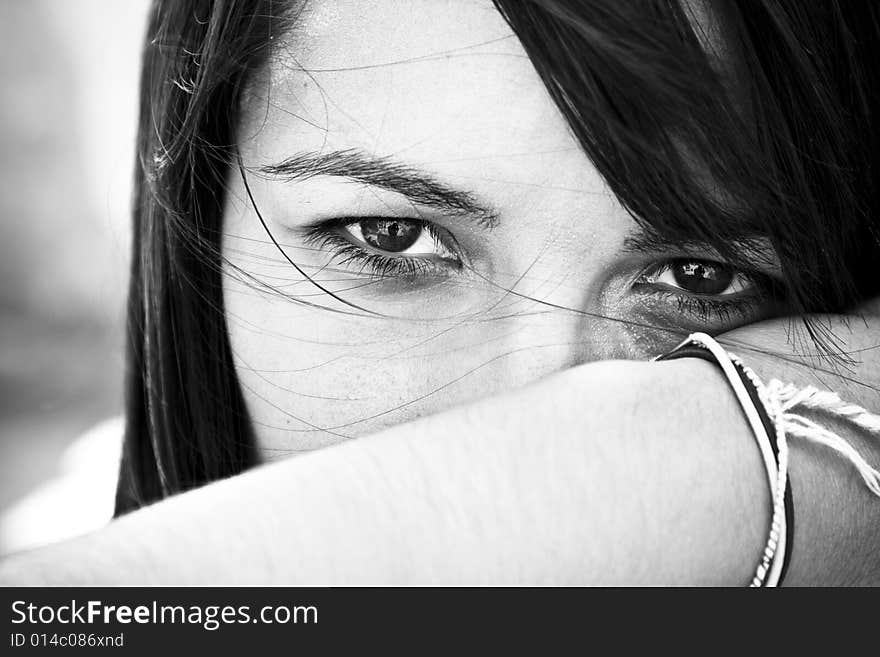 Young staring woman in contrasted black and white.