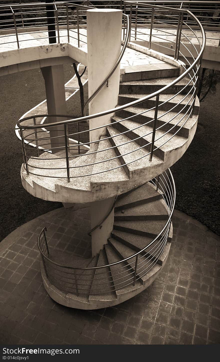 Modern outdoor spiral stair way in tropical area. Modern outdoor spiral stair way in tropical area