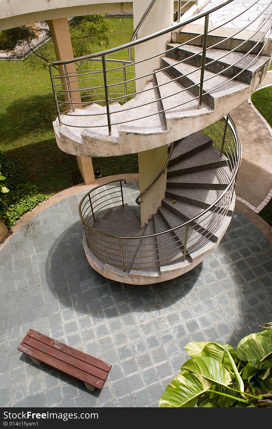 Modern outdoor spiral stair way in tropical area. Modern outdoor spiral stair way in tropical area