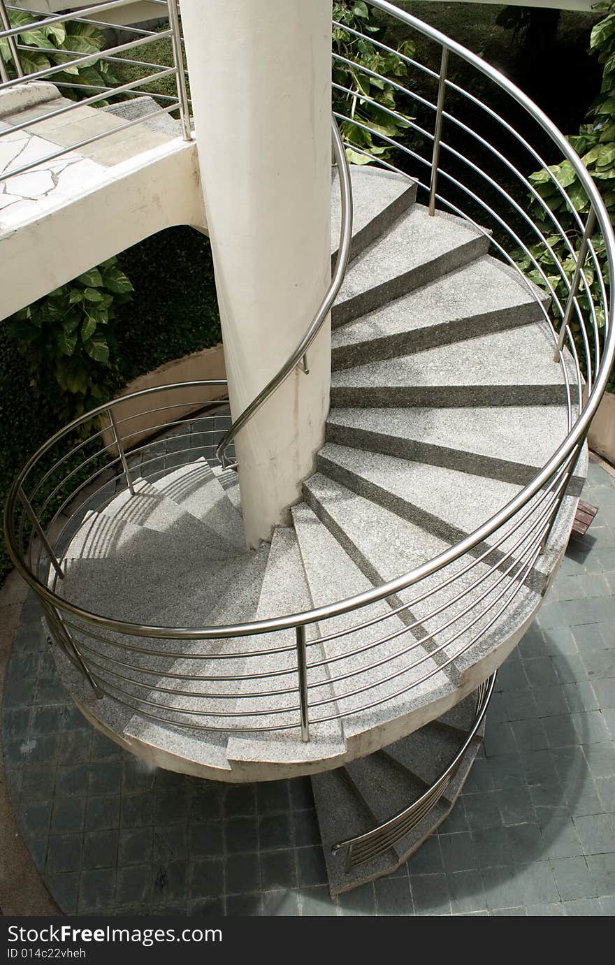 Modern outdoor spiral stair way in tropical area. Modern outdoor spiral stair way in tropical area