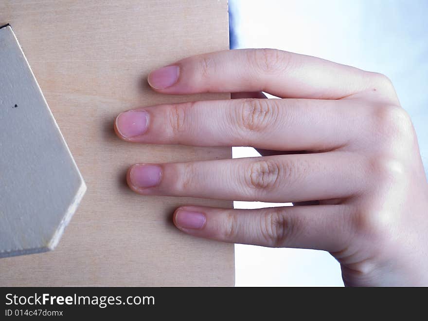 Close up observation of Female hand holding wooden mirror. Close up observation of Female hand holding wooden mirror