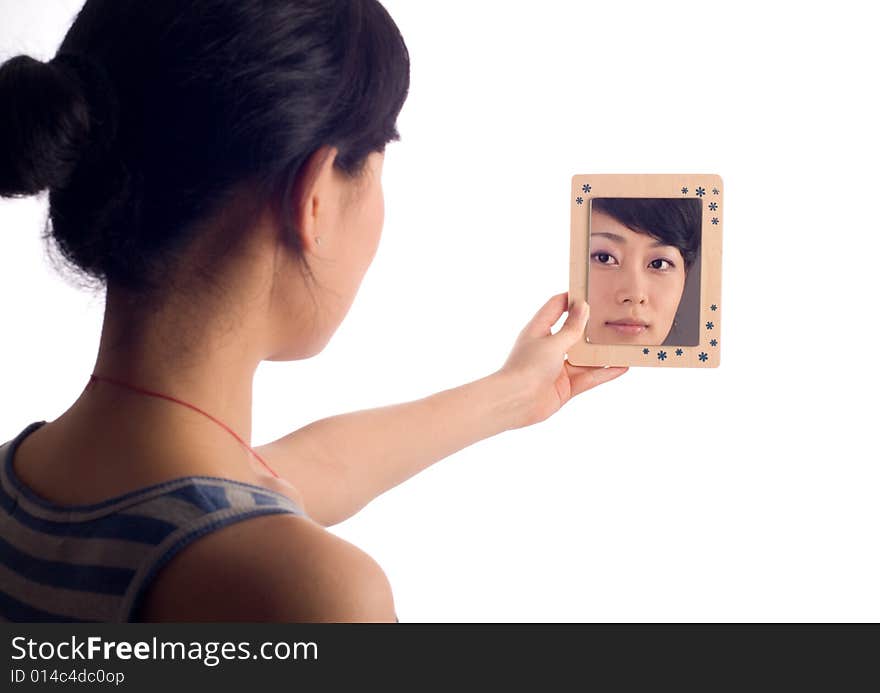 Love lady looking at mirror with wooden boarder. Love lady looking at mirror with wooden boarder