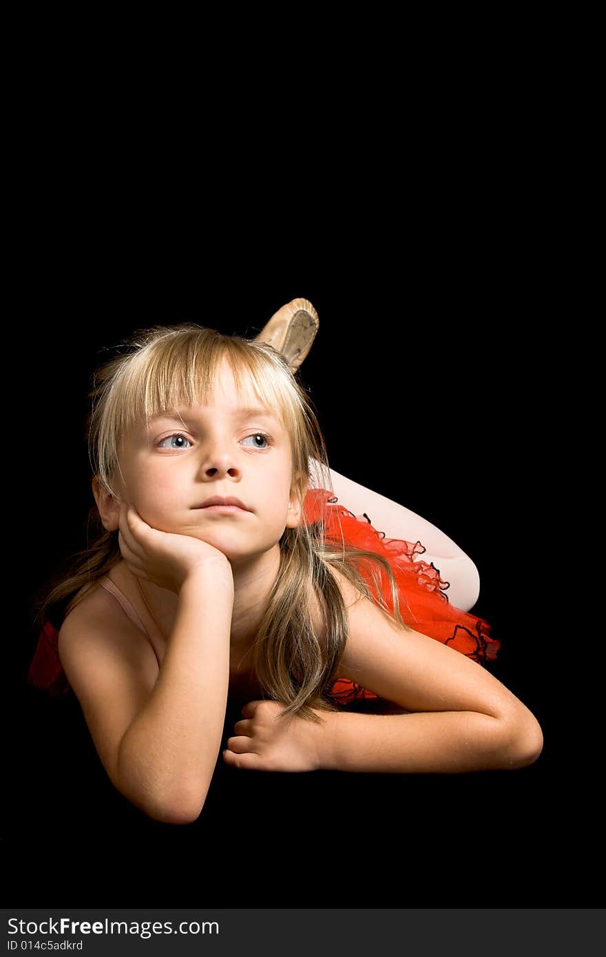 Young ballet dancer wearing a red costume. Young ballet dancer wearing a red costume