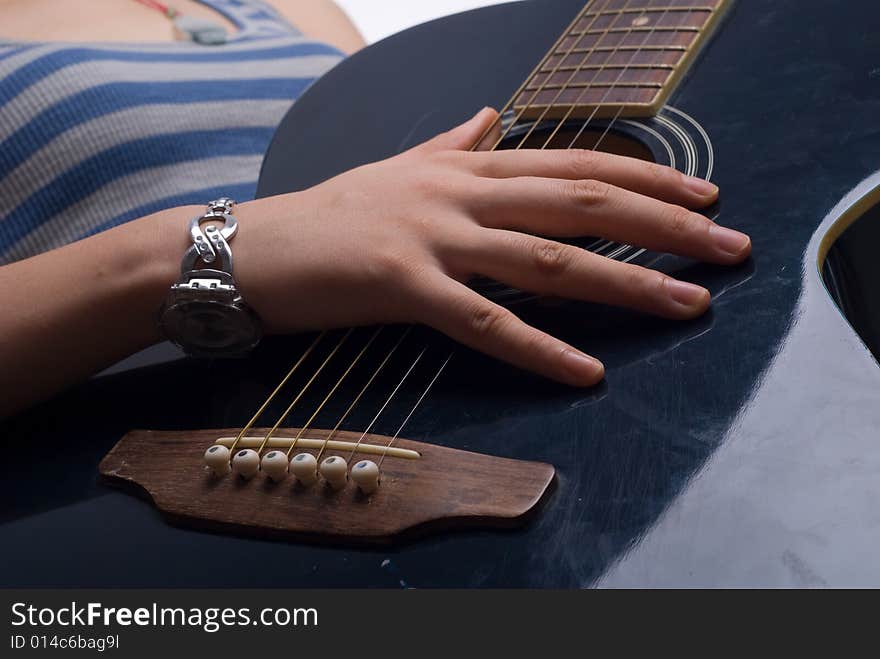 Female hand with classical antique wooden guitar. Female hand with classical antique wooden guitar