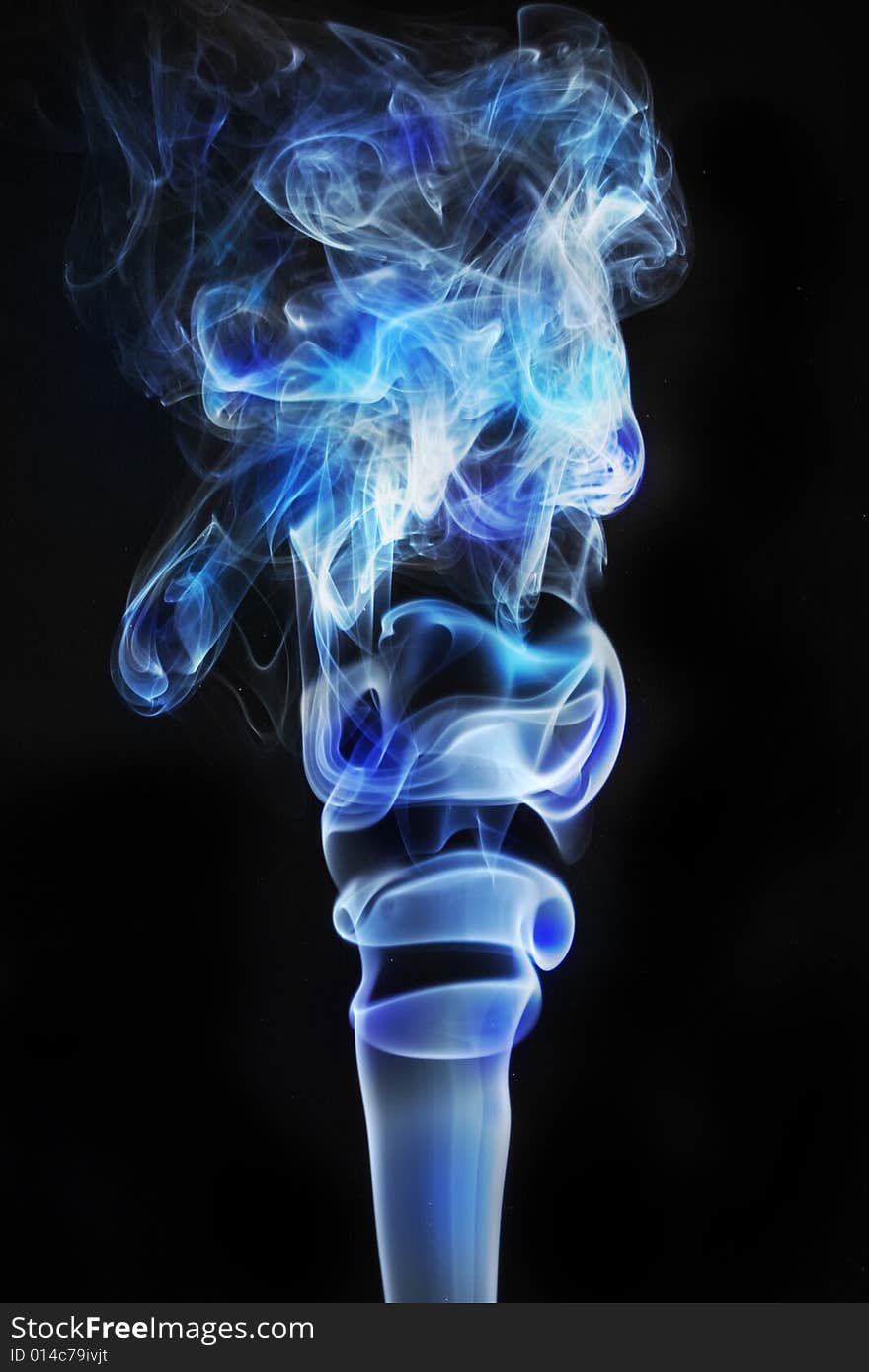 Colored smoke in black background;