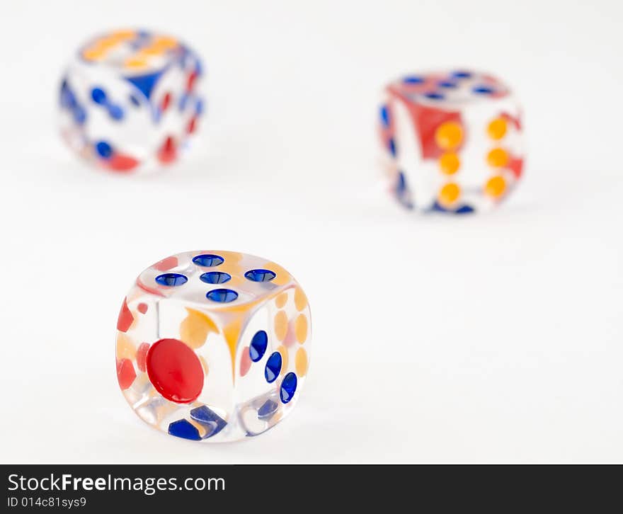 Still life of three plastic dice on white background. Still life of three plastic dice on white background