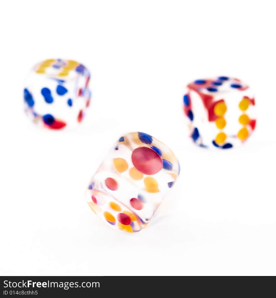 Motion blurred spinning dice against a background of two thrown dice. Motion blurred spinning dice against a background of two thrown dice