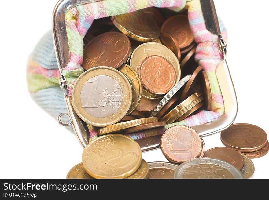 Coins are in the purse on white