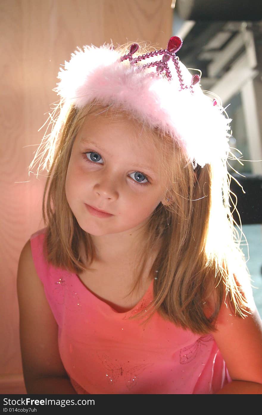 Young girl sitting and smiling at camera