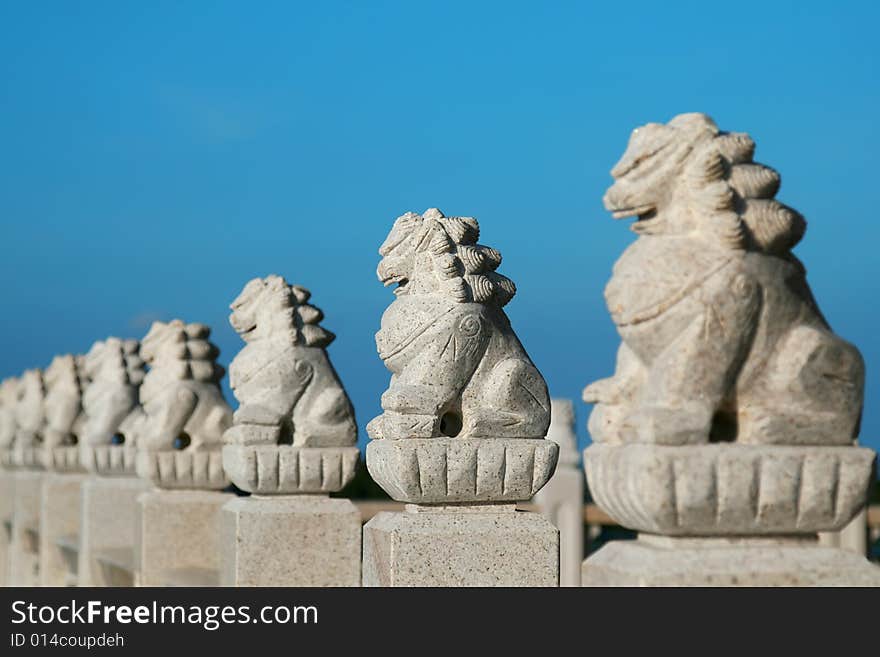 Chinese stone lion in the blue sky.