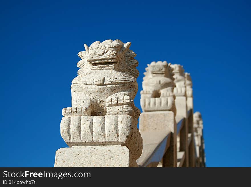 Chinese stone lion in the blue sky.