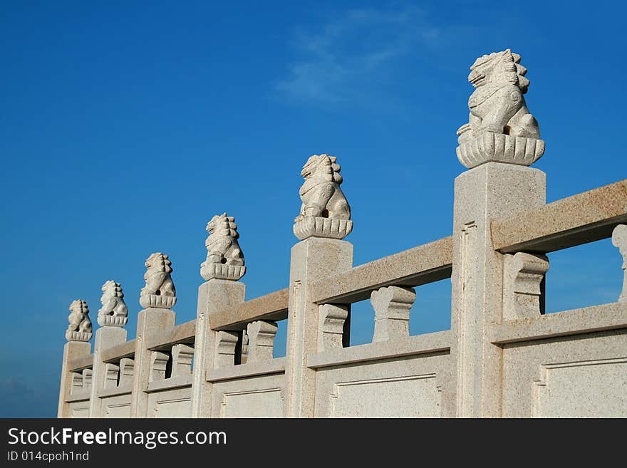 Chinese stone lion in the blue sky.