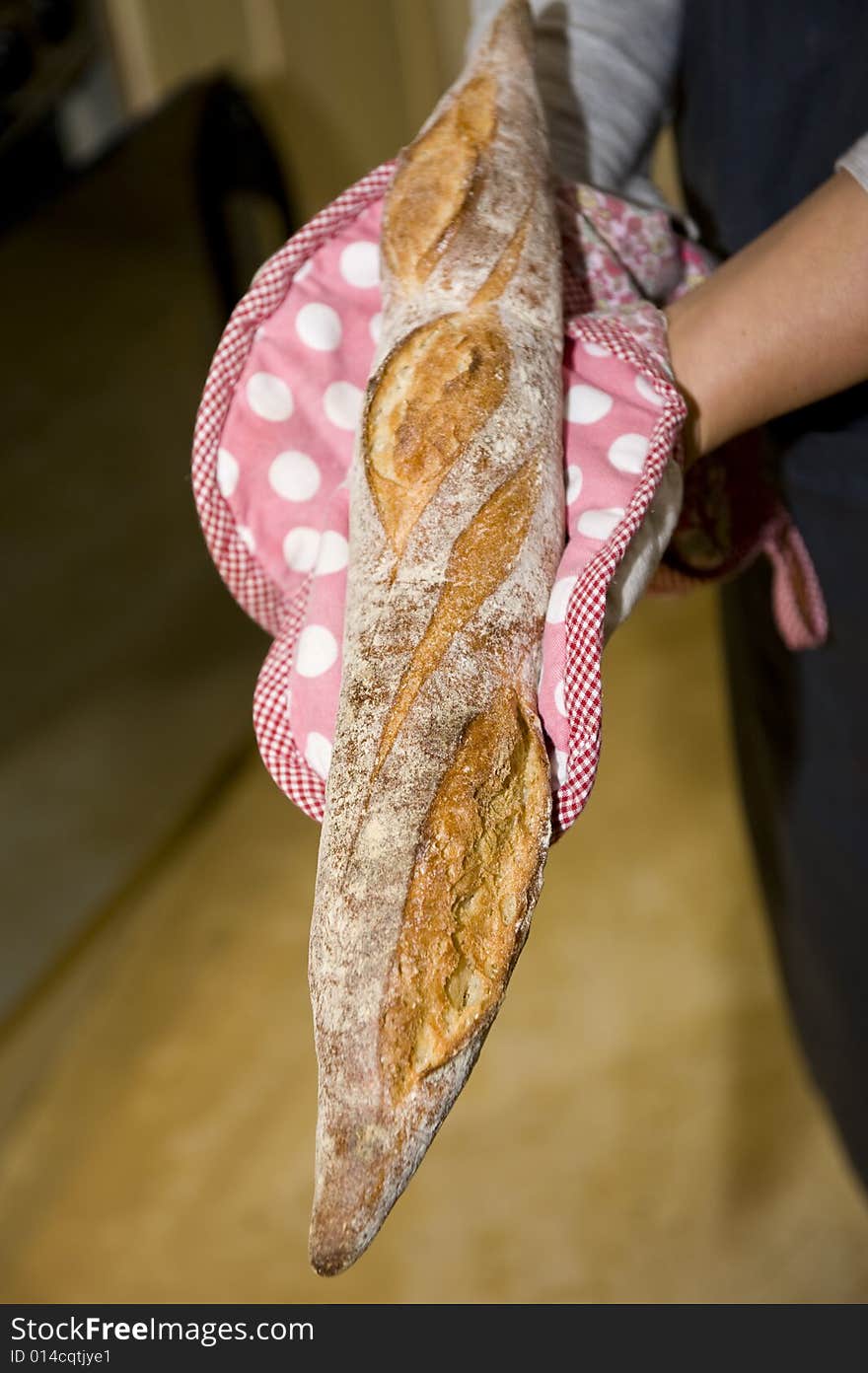 Chef holding fresh bread