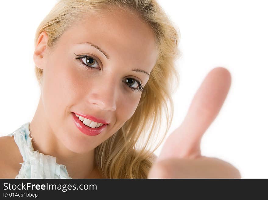 Closeup of a smiling young woman showing thumbs up sign over white background. Closeup of a smiling young woman showing thumbs up sign over white background