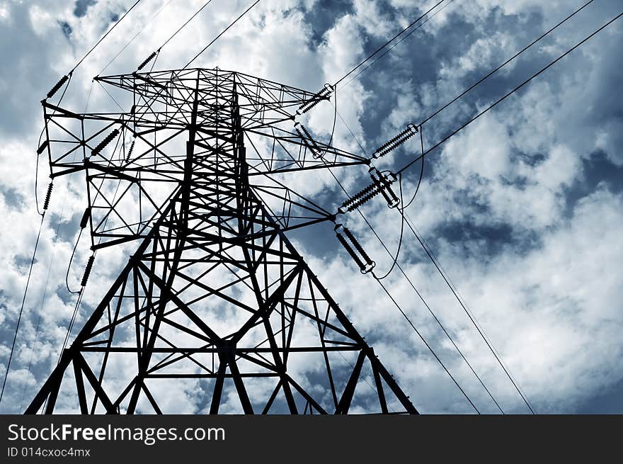 Electrical pylon and power lines with a cloudy sky. Electrical pylon and power lines with a cloudy sky.