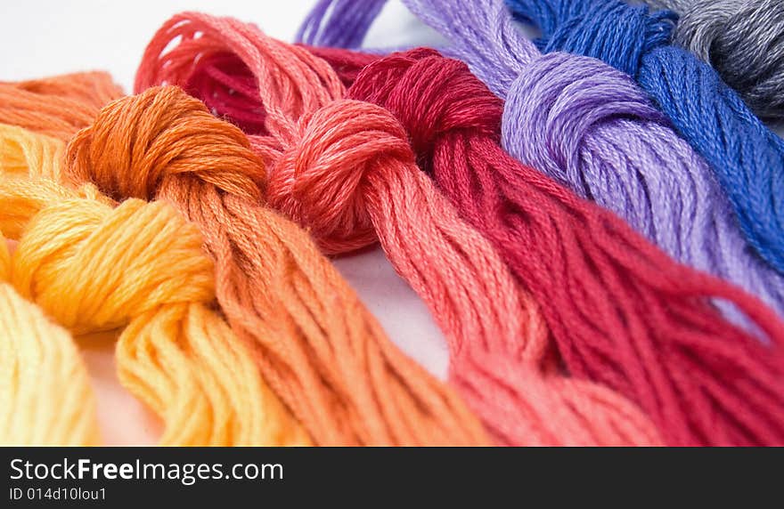 Close-up of colorful buns of threads