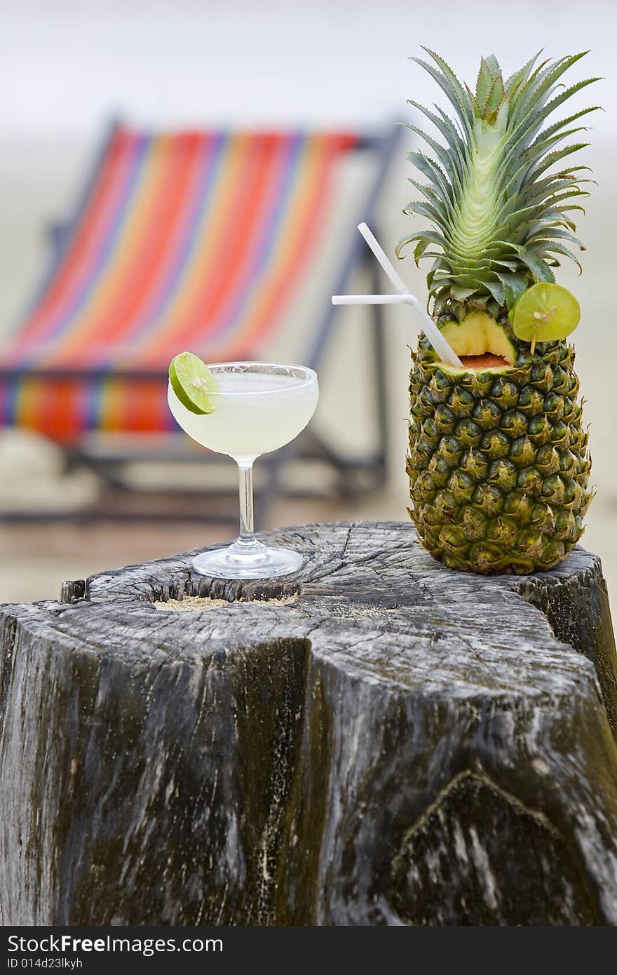 Pineapple, cocktail on the beach