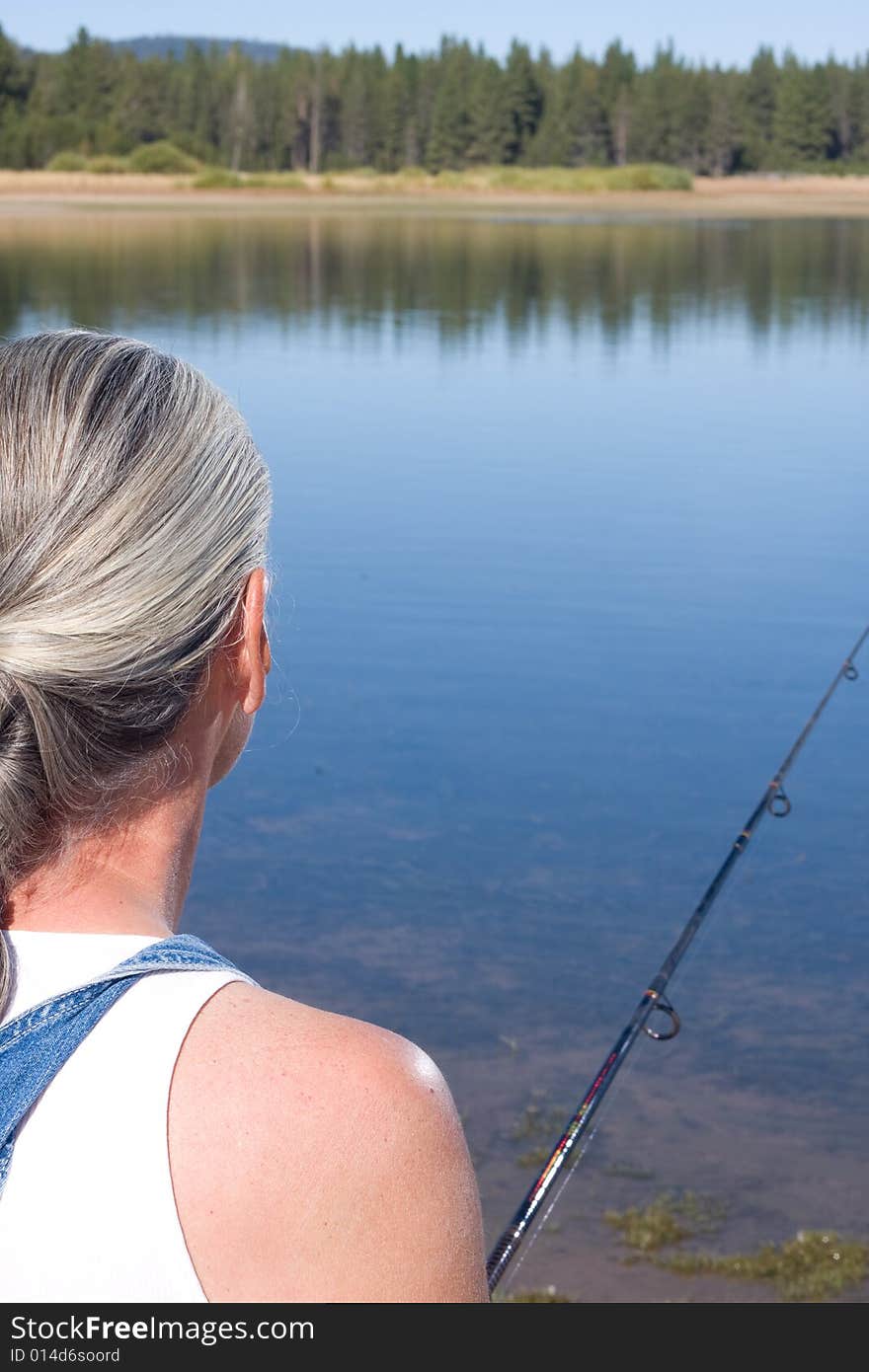 Senior woman fishing at lake