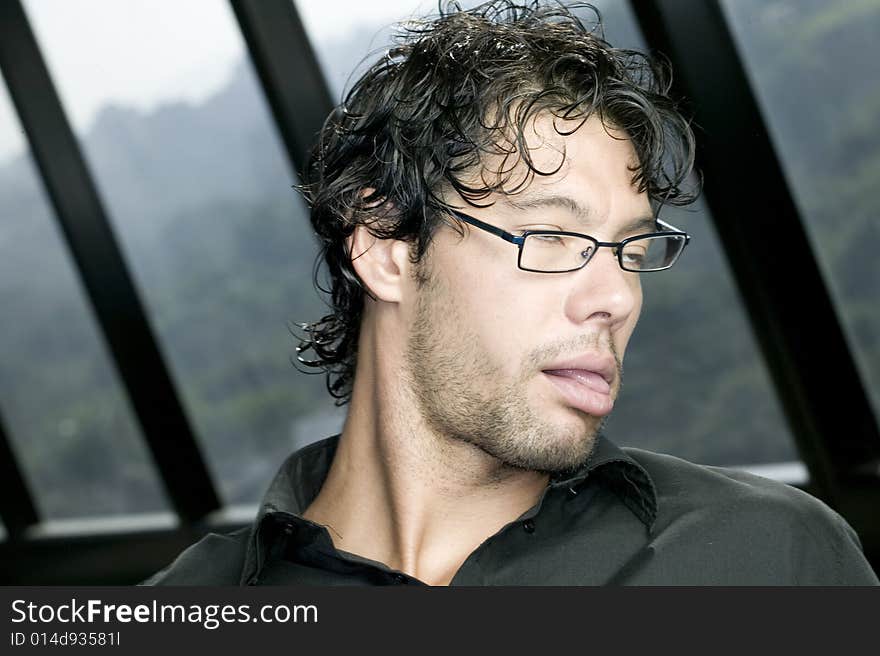 Young man with glasses making a funny face. Young man with glasses making a funny face