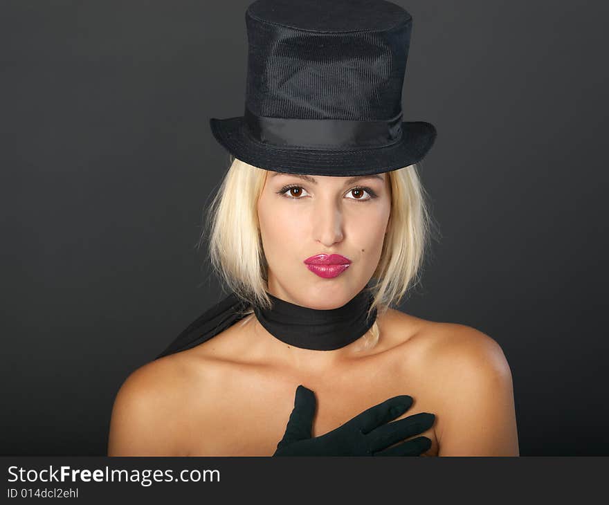 Blonde Woman In Black Hat And Scarf.