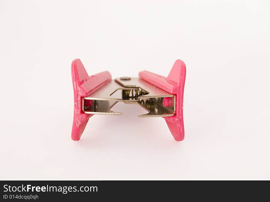 Front view of pink staple remover isolated on white background. Front view of pink staple remover isolated on white background