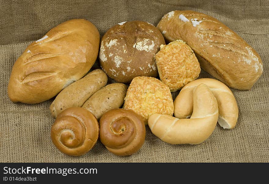 Assortment of different baked bread and natural backdrop. Assortment of different baked bread and natural backdrop